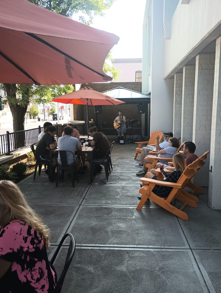 live music and karaoke played on the pearl city hops patio in the summer